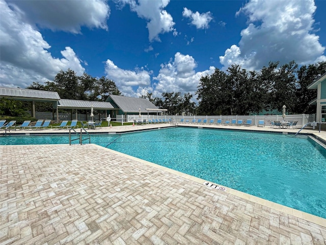 view of swimming pool featuring a patio