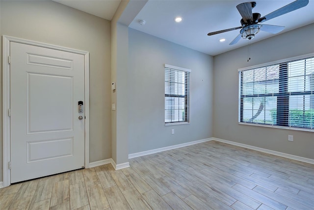 foyer entrance featuring ceiling fan