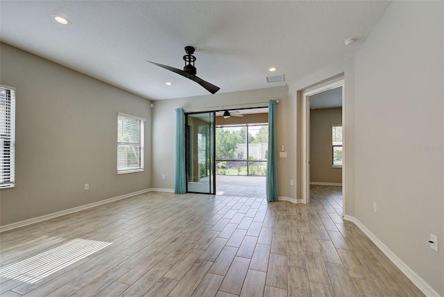 unfurnished room with plenty of natural light and ceiling fan