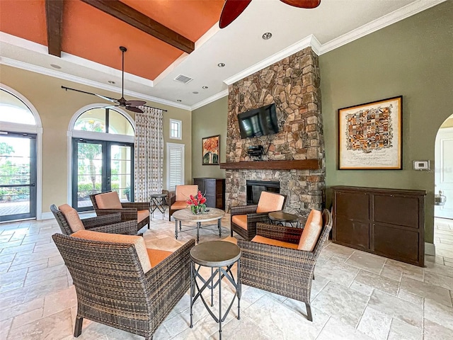 living room featuring french doors, ornamental molding, a towering ceiling, a fireplace, and beam ceiling