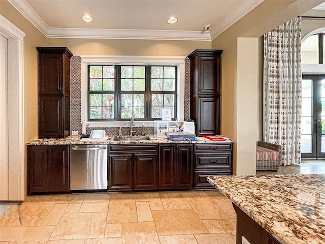 kitchen featuring dishwasher, dark brown cabinetry, light stone counters, and sink