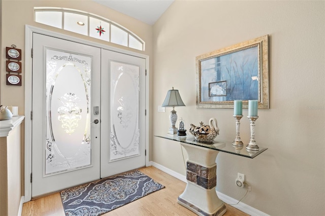 entryway with light wood-type flooring and french doors