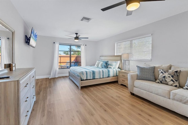 bedroom with light hardwood / wood-style flooring and ceiling fan