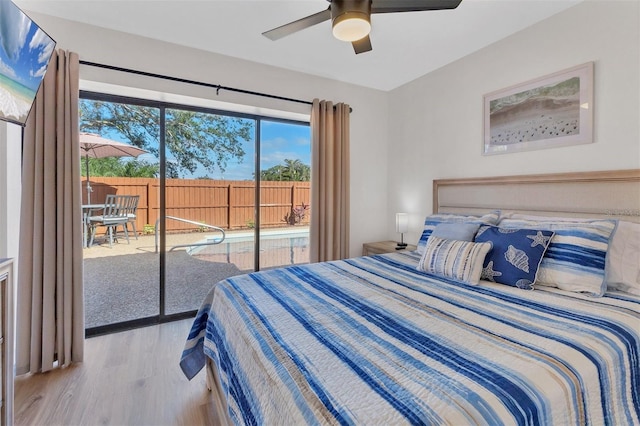 bedroom featuring access to outside, light hardwood / wood-style flooring, and ceiling fan