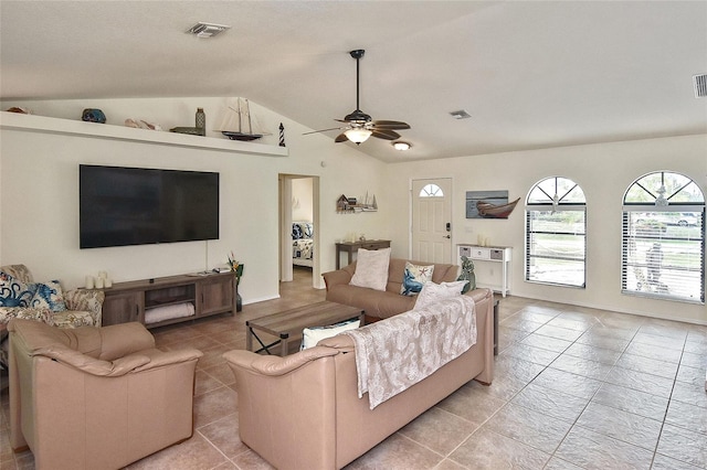 tiled living room featuring lofted ceiling and ceiling fan