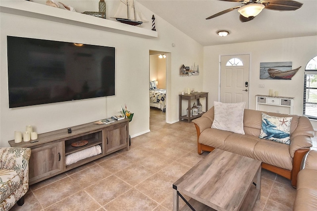 tiled living room featuring lofted ceiling and ceiling fan