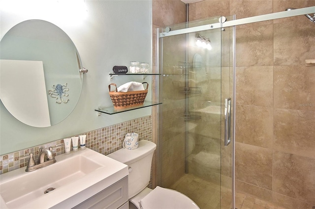 bathroom with tile walls, backsplash, walk in shower, toilet, and vanity