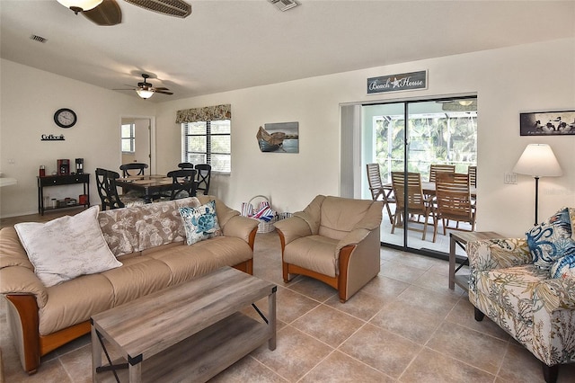 tiled living room featuring ceiling fan