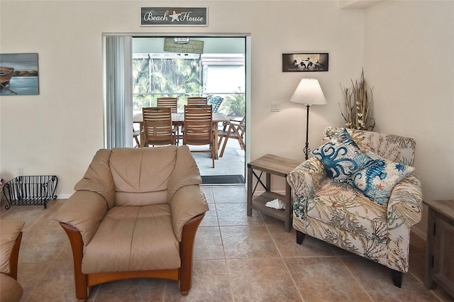 living room with tile patterned flooring