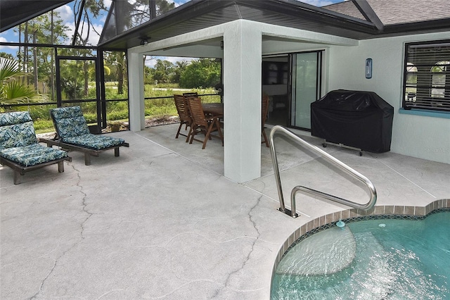 view of pool with a patio, area for grilling, and a lanai