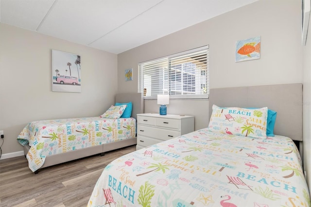 bedroom with light hardwood / wood-style flooring