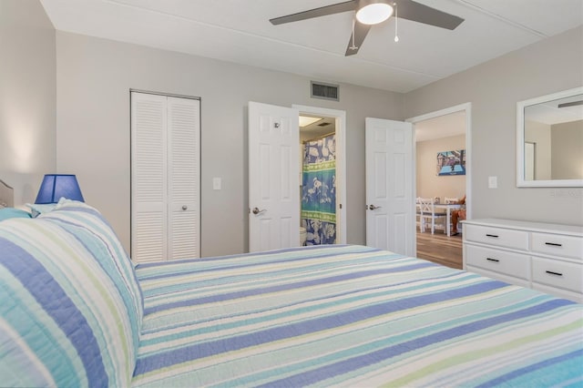 bedroom featuring ceiling fan and a closet