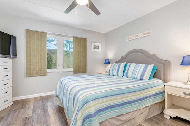 bedroom featuring ceiling fan and light wood-type flooring