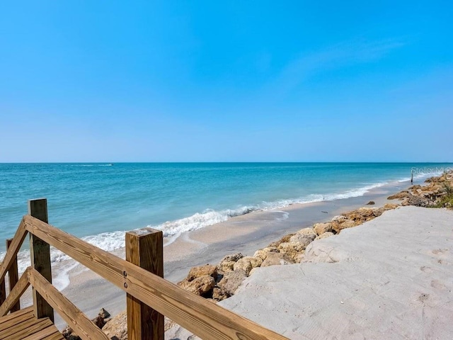 property view of water featuring a beach view