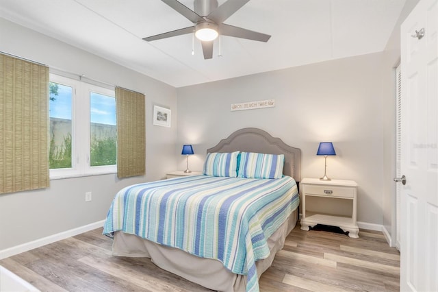 bedroom featuring ceiling fan and light hardwood / wood-style flooring