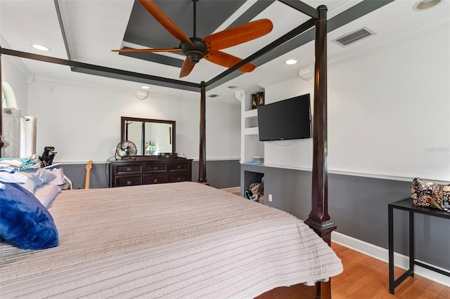 bedroom with ceiling fan, ornamental molding, and light hardwood / wood-style floors