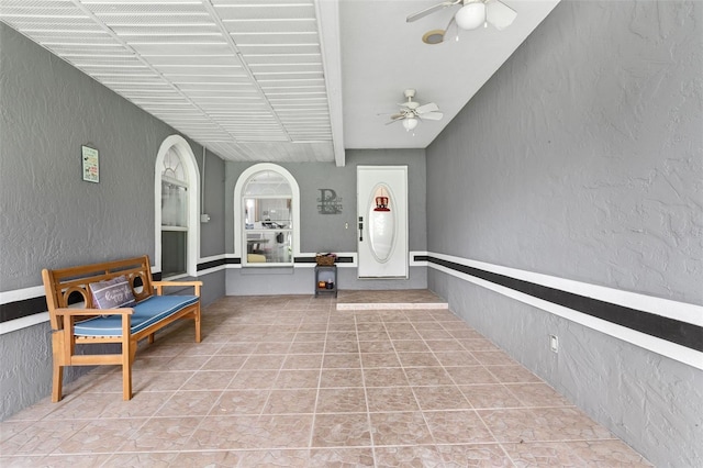 interior space featuring ceiling fan