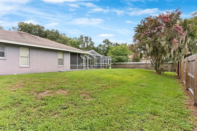 view of yard featuring a lanai