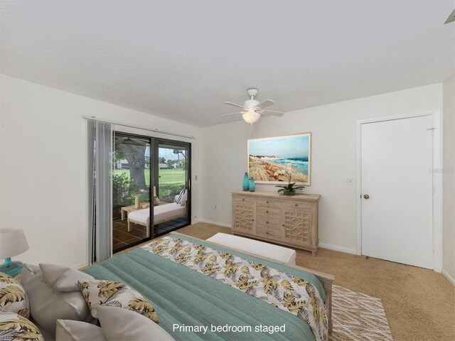 carpeted bedroom with a textured ceiling, ceiling fan, and access to exterior