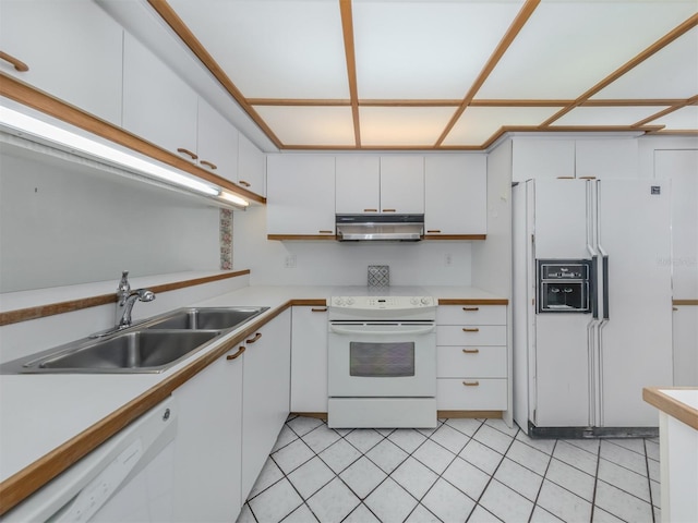 kitchen featuring sink, white cabinetry, white appliances, and light tile patterned floors