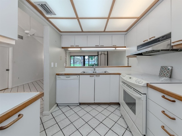 kitchen with white appliances, sink, light tile patterned flooring, white cabinetry, and ceiling fan