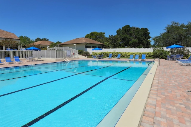 view of swimming pool with a patio area