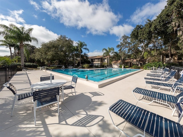 view of swimming pool featuring a patio area