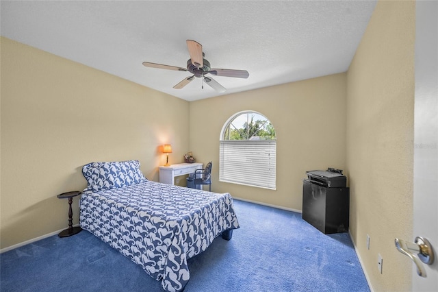 bedroom with ceiling fan and carpet