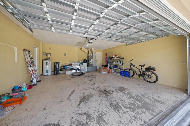 garage featuring water heater and a garage door opener