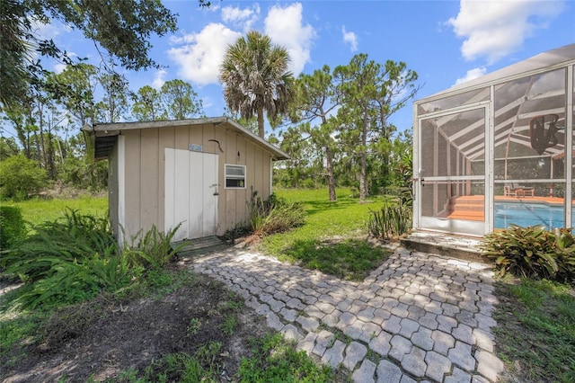 view of outbuilding featuring a yard