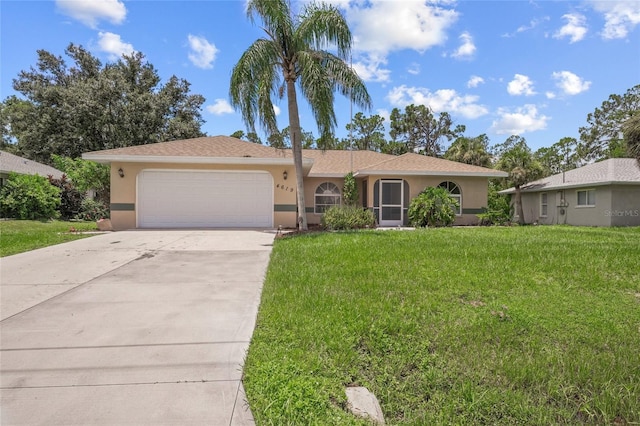 single story home featuring a front lawn and a garage