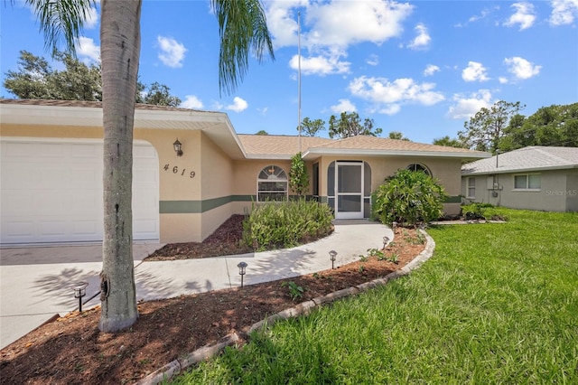 ranch-style home with a garage and a front lawn