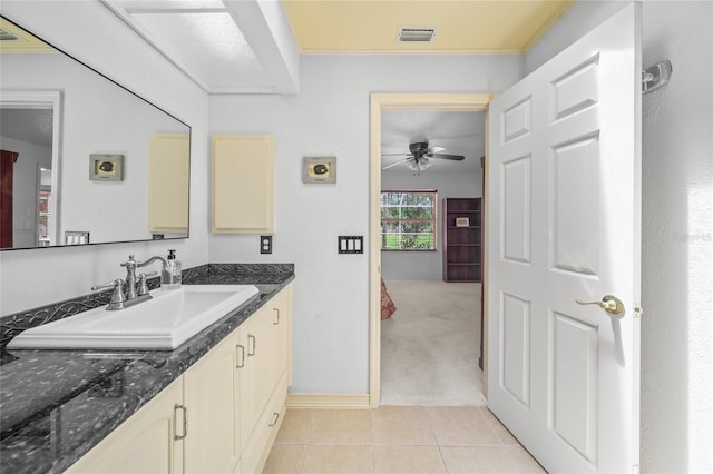 bathroom with ceiling fan, vanity, and tile patterned flooring