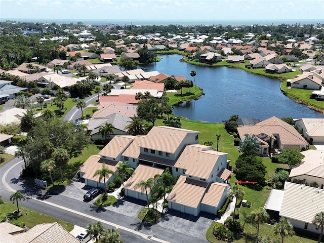 aerial view featuring a residential view and a water view