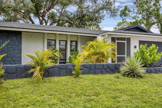 exterior space with a front lawn