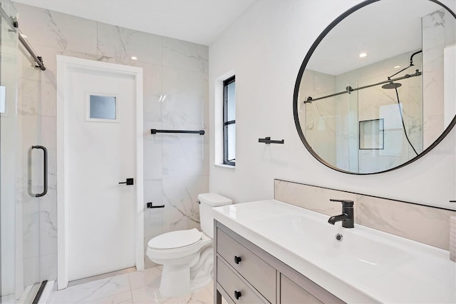 bathroom featuring vanity, toilet, and a shower with door