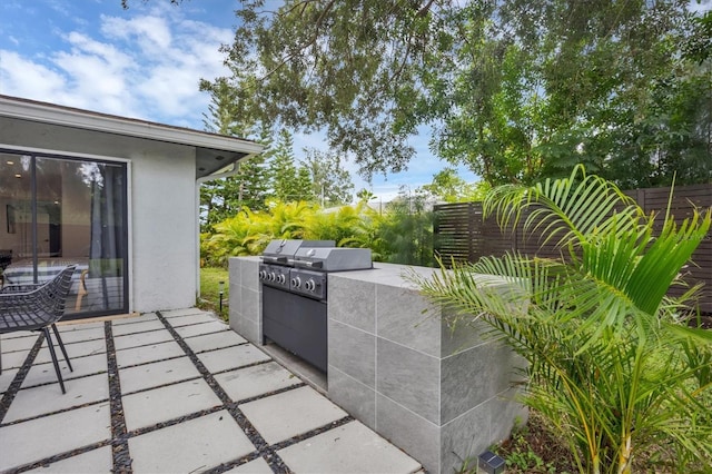 view of patio / terrace featuring grilling area and exterior kitchen