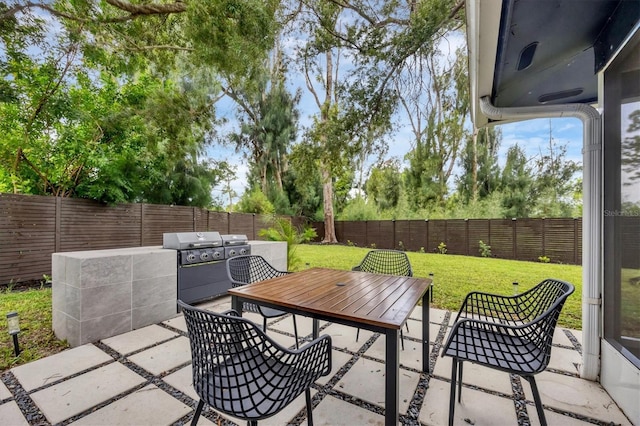 view of patio with exterior kitchen and grilling area