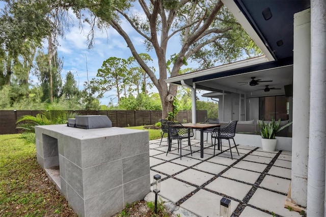 view of patio with ceiling fan and exterior kitchen