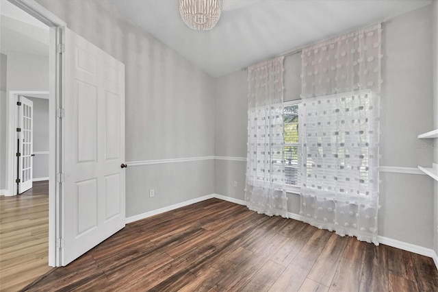 spare room featuring dark hardwood / wood-style flooring