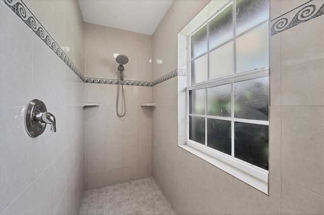 bathroom featuring tiled shower