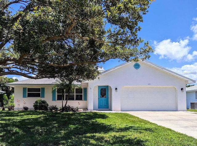 ranch-style house featuring a garage, central AC, and a front yard