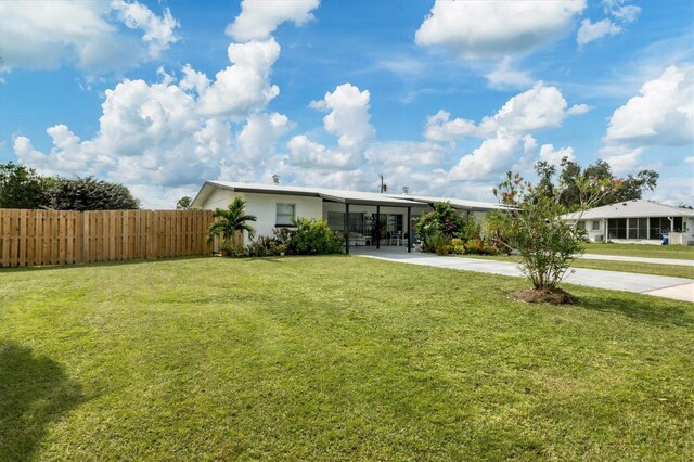 ranch-style house featuring a front lawn