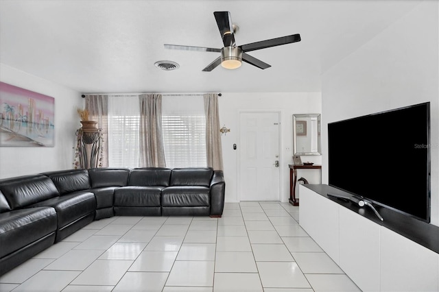 tiled living room featuring ceiling fan