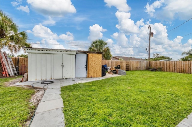 view of outbuilding with a yard