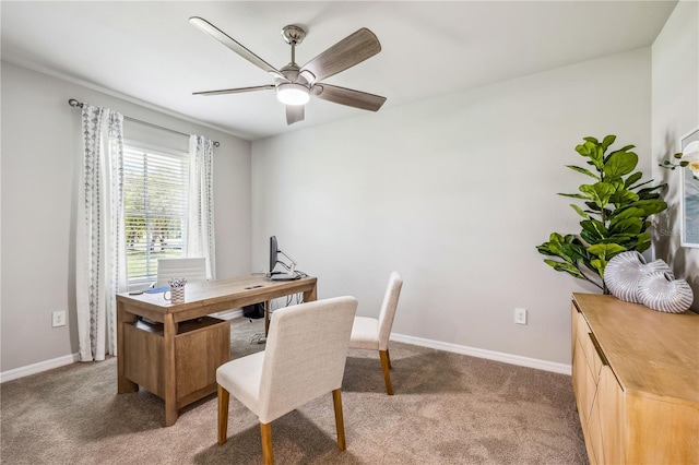 home office with ceiling fan and dark colored carpet