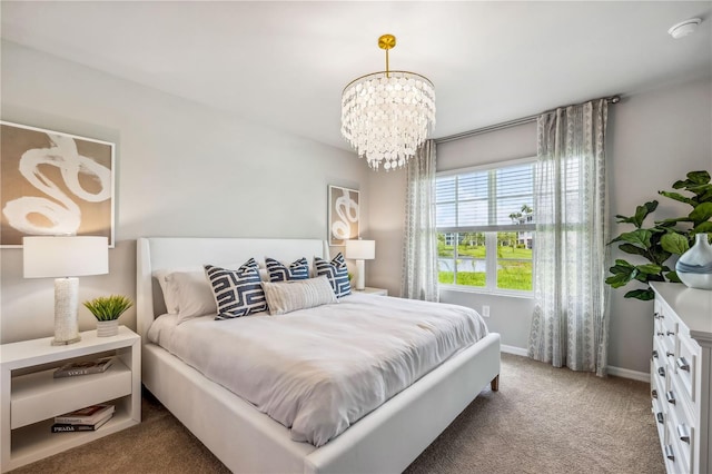 carpeted bedroom featuring an inviting chandelier