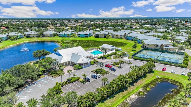 bird's eye view featuring a water view and a residential view