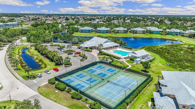 birds eye view of property with a water view and a residential view