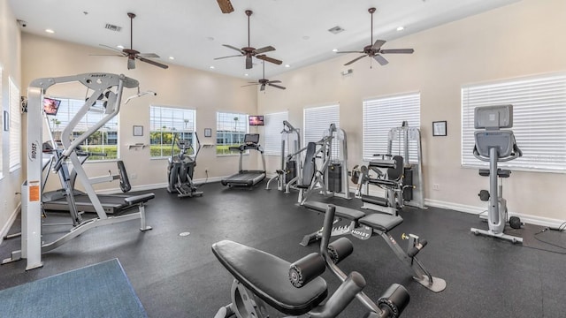 workout area featuring baseboards, visible vents, and recessed lighting